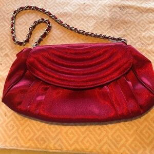 Red satin clutch with chain handle, snap lock, clean but used. Prom, wedding.